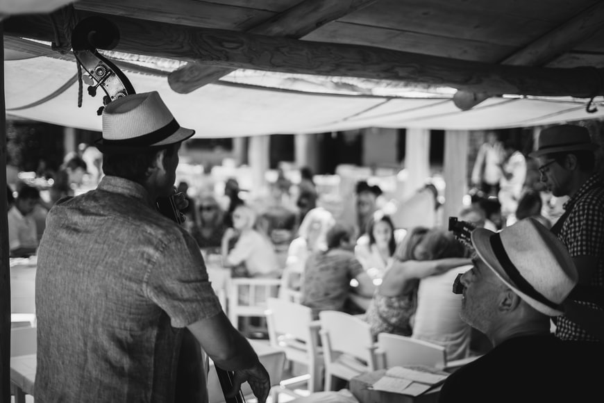People enjoying their food with live music playing in the background. 